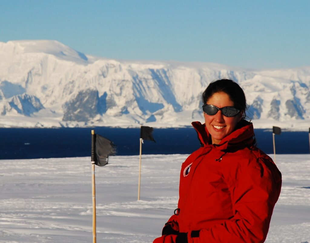 Woman standing on ice with snow and ice background