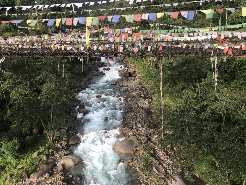 waterfall and Buddhist prayer flags